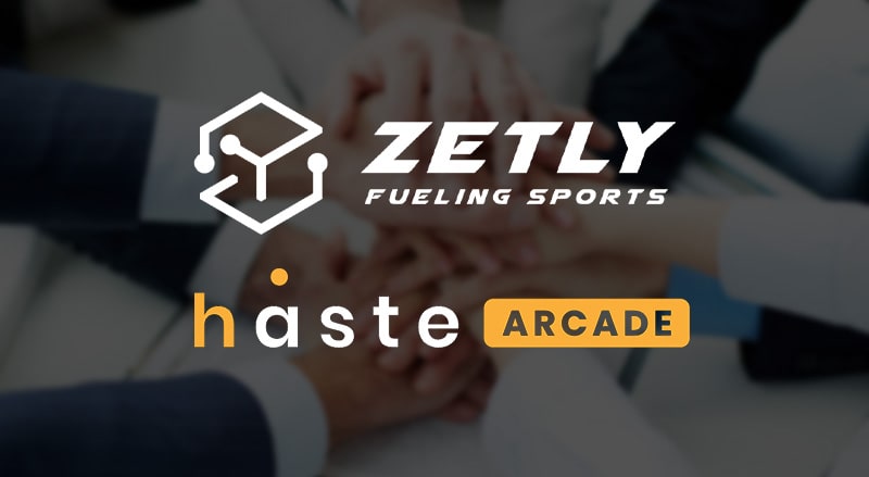 Zetly and Haste Arcade logo over businessmen agreeing on new sports metaverse partnership