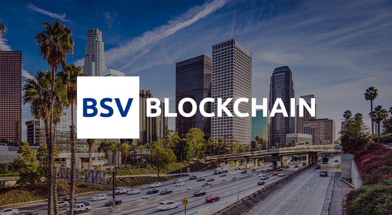 BSV Blockchain logo over Southern California Skyline venue of Southern California Blockchain Summit