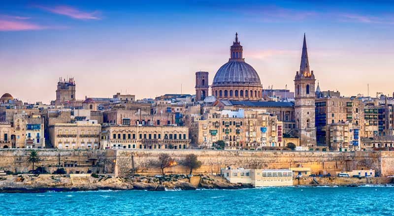 Valletta, Malta: skyline from Marsans Harbour at sunset